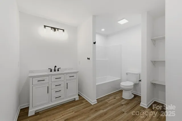 a bathroom with a toilet a sink and a bathtub
