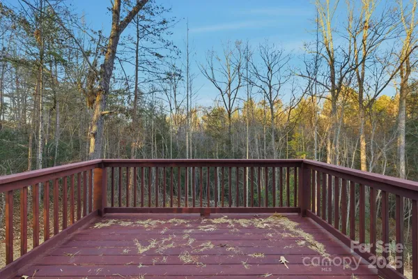 a view of a balcony with trees