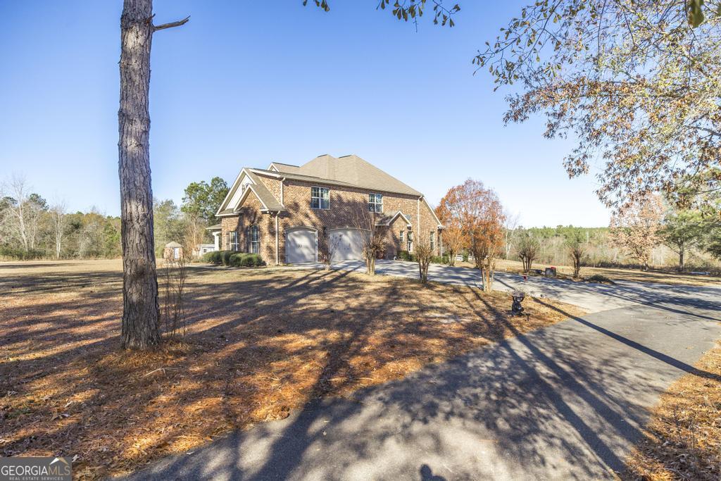 4065 Gordon Road Abbeville, GA 31001 - Photo 2 of 48 a view of a yard with street