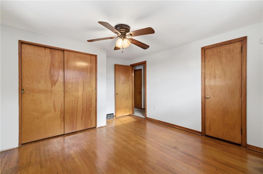 1368 Cathell Road Pittsburgh, PA 15236 - Photo 14 of 28 a view of empty room with wooden floor and fan