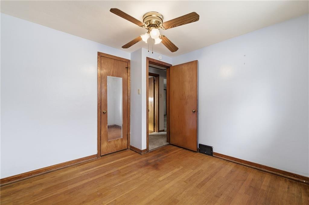 1368 Cathell Road Pittsburgh, PA 15236 - Photo 19 of 28 an empty room with closet and a ceiling fan