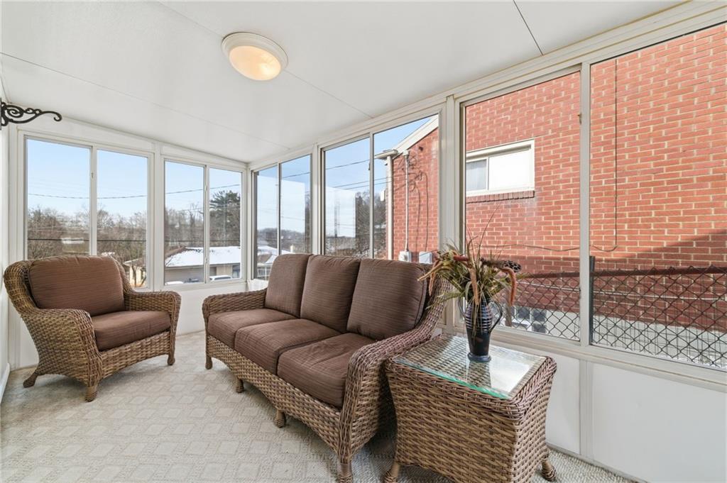 1368 Cathell Road Pittsburgh, PA 15236 - Photo 20 of 28 a living room with furniture and a floor to ceiling window