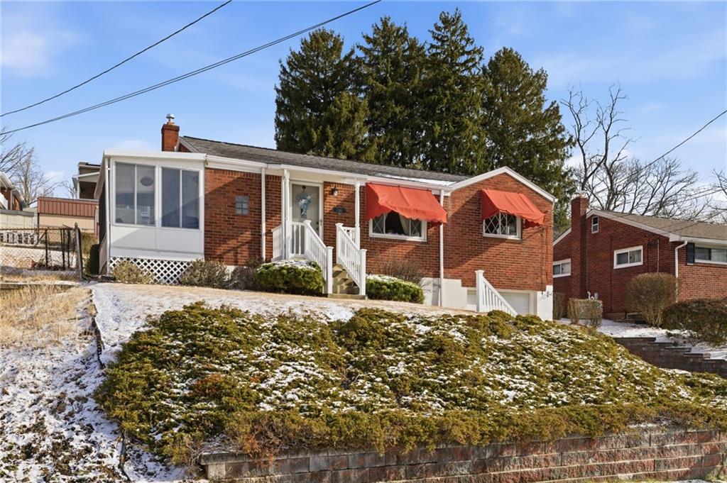 1368 Cathell Road Pittsburgh, PA 15236 - Photo 2 of 28 a front view of a house with a yard