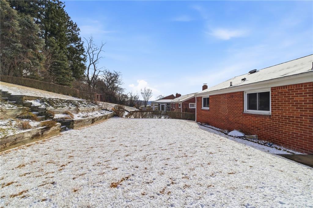 1368 Cathell Road Pittsburgh, PA 15236 - Photo 27 of 28 a backyard of a house with a yard