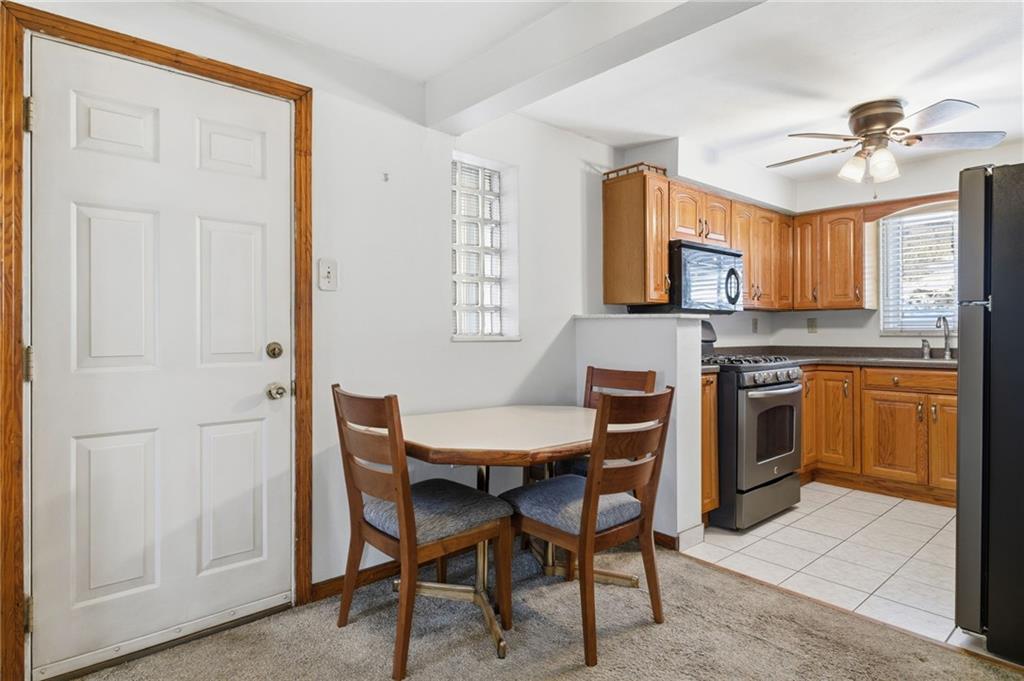 1368 Cathell Road Pittsburgh, PA 15236 - Photo 8 of 28 a kitchen with stainless steel appliances a stove a sink dishwasher and a refrigerator