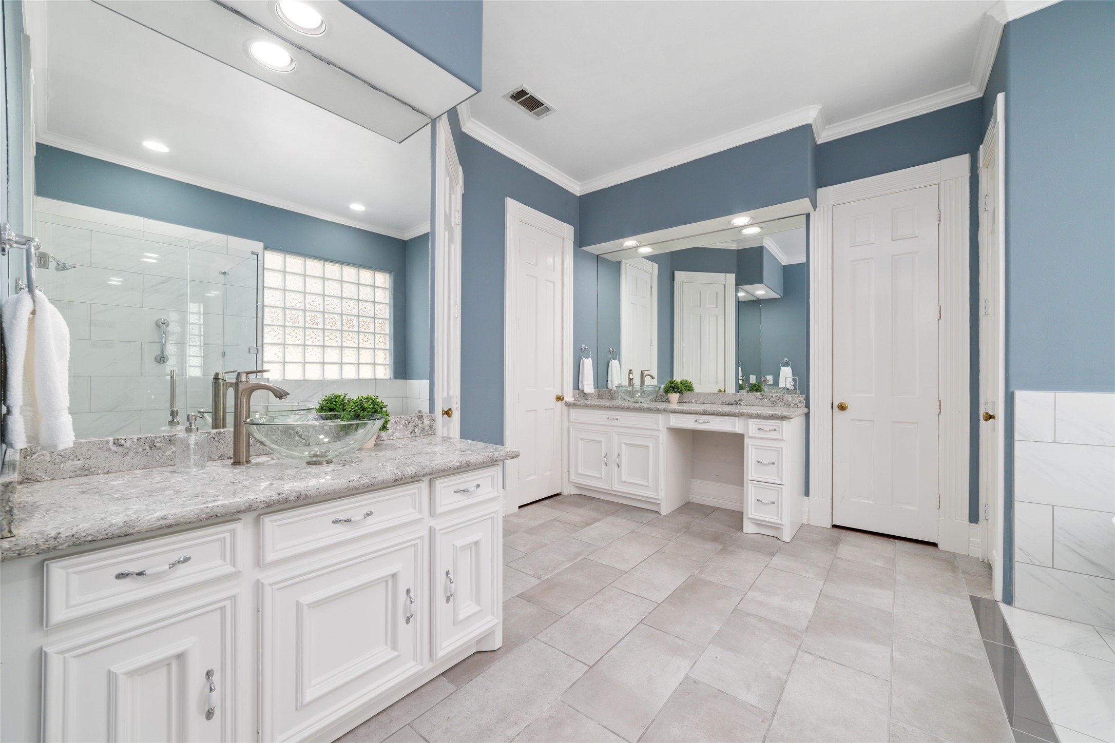 16114 Lafone Drive Spring, TX 77379 - Photo 18 of 45 The updated primary bath featuring separate vanities with abundant countertop and storage space.