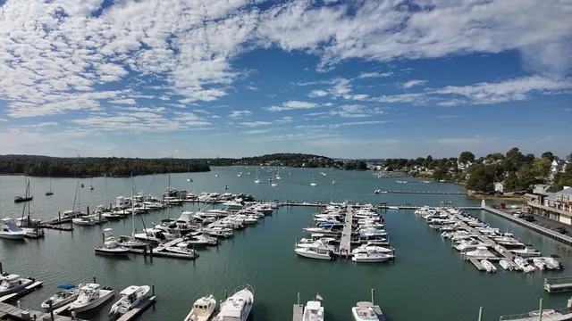 an aerial view of a houses with ocean view