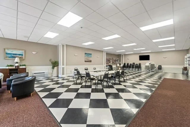 a room with lots of black and white checkered flooring