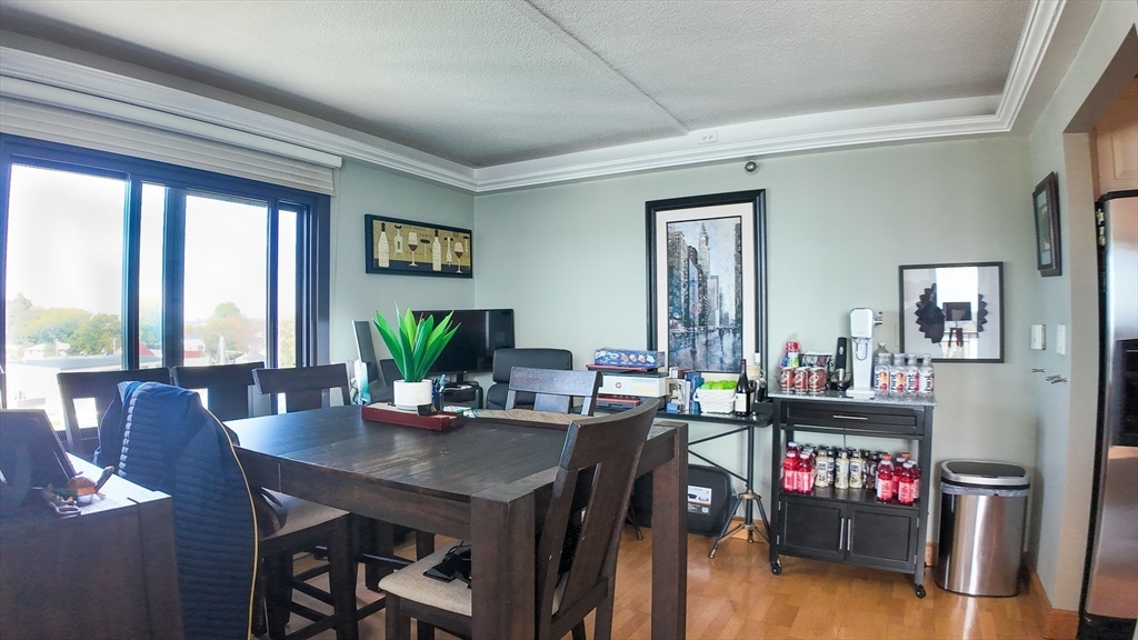51 Broad Reach, Unit M65A Weymouth, MA 02191 - Photo 5 of 16 a view of a dining room with furniture window and wooden floor