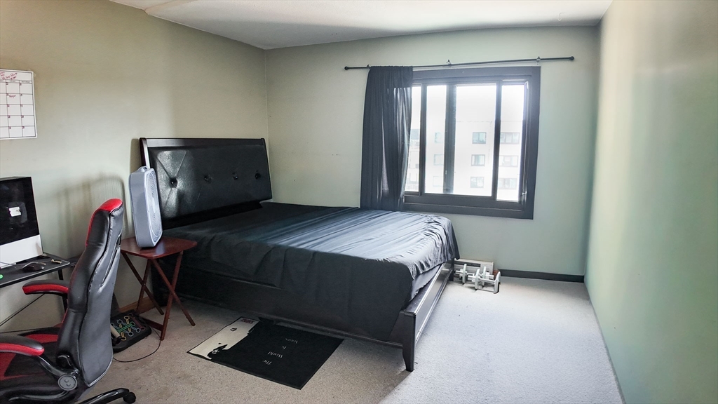 51 Broad Reach, Unit M65A Weymouth, MA 02191 - Photo 9 of 16 a bedroom with a bed and a window