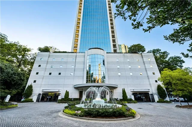 a view of a door and tree in front of it