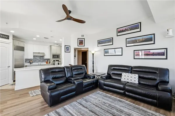 a kitchen with stainless steel appliances a sink stove and refrigerator
