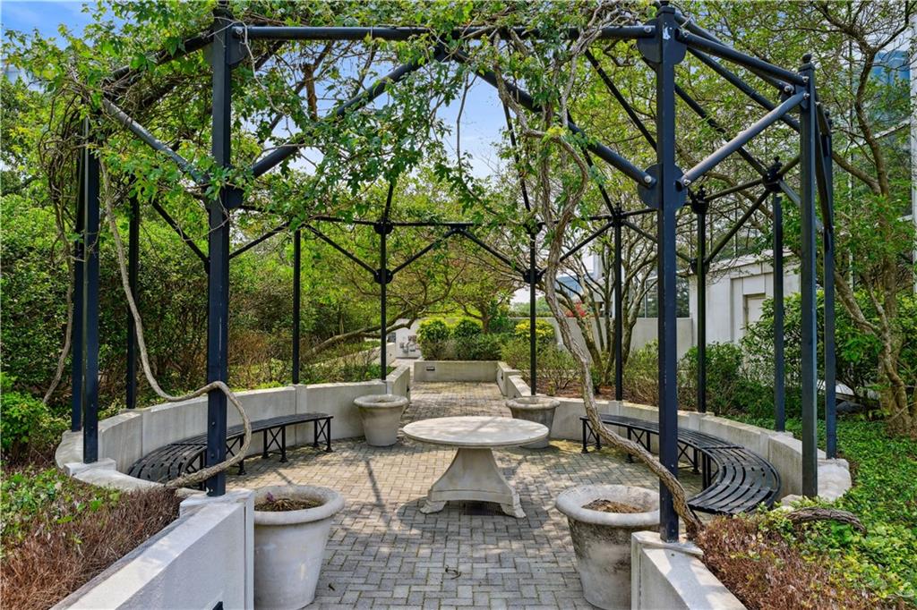 2828 Peachtree Road Northwest, Unit 2502 Atlanta, GA 30305 - Photo 24 of 38 a view of a patio with couches table and chairs and potted plants