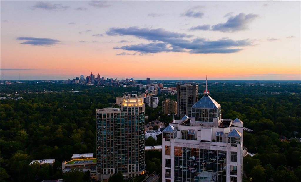2828 Peachtree Road Northwest, Unit 2502 Atlanta, GA 30305 - Photo 31 of 38 a front view of house with yard and green space