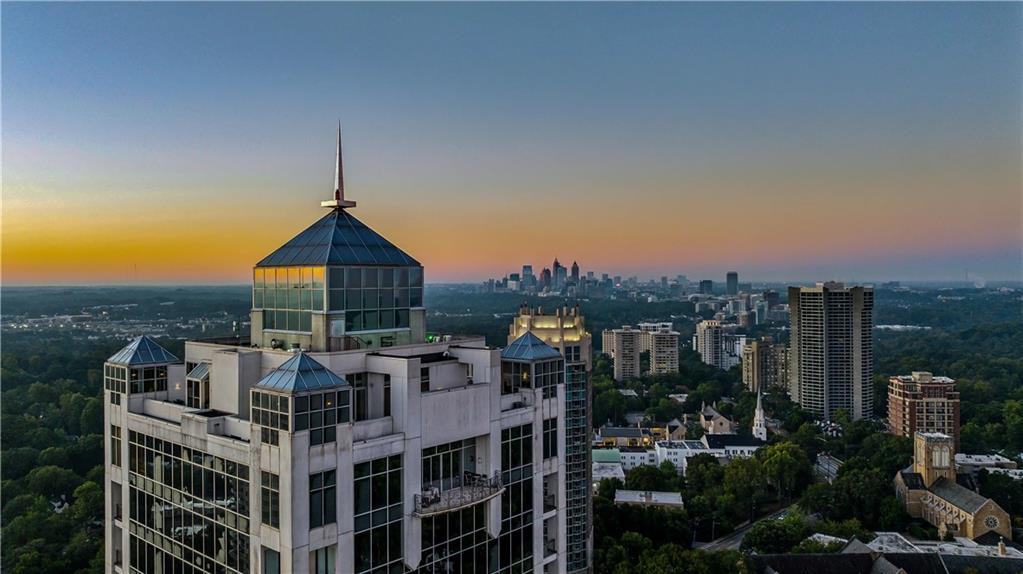 2828 Peachtree Road Northwest, Unit 2502 Atlanta, GA 30305 - Photo 35 of 38 a front view of a residential apartment building with a yard