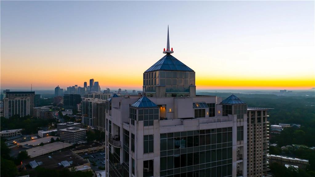 2828 Peachtree Road Northwest, Unit 2502 Atlanta, GA 30305 - Photo 36 of 38 a front view of a house with a yard