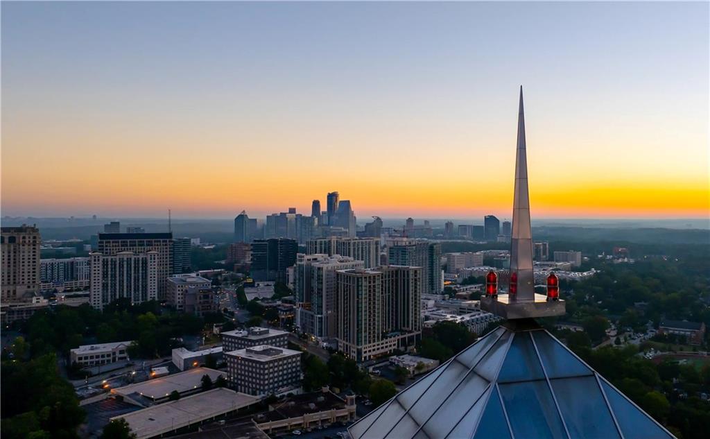 2828 Peachtree Road Northwest, Unit 2502 Atlanta, GA 30305 - Photo 37 of 38 a view of a balcony with wooden floor and city view