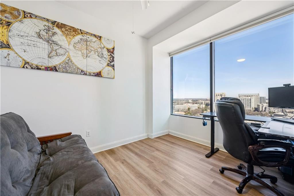 2828 Peachtree Road Northwest, Unit 2502 Atlanta, GA 30305 - Photo 7 of 38 a bedroom with a workspace