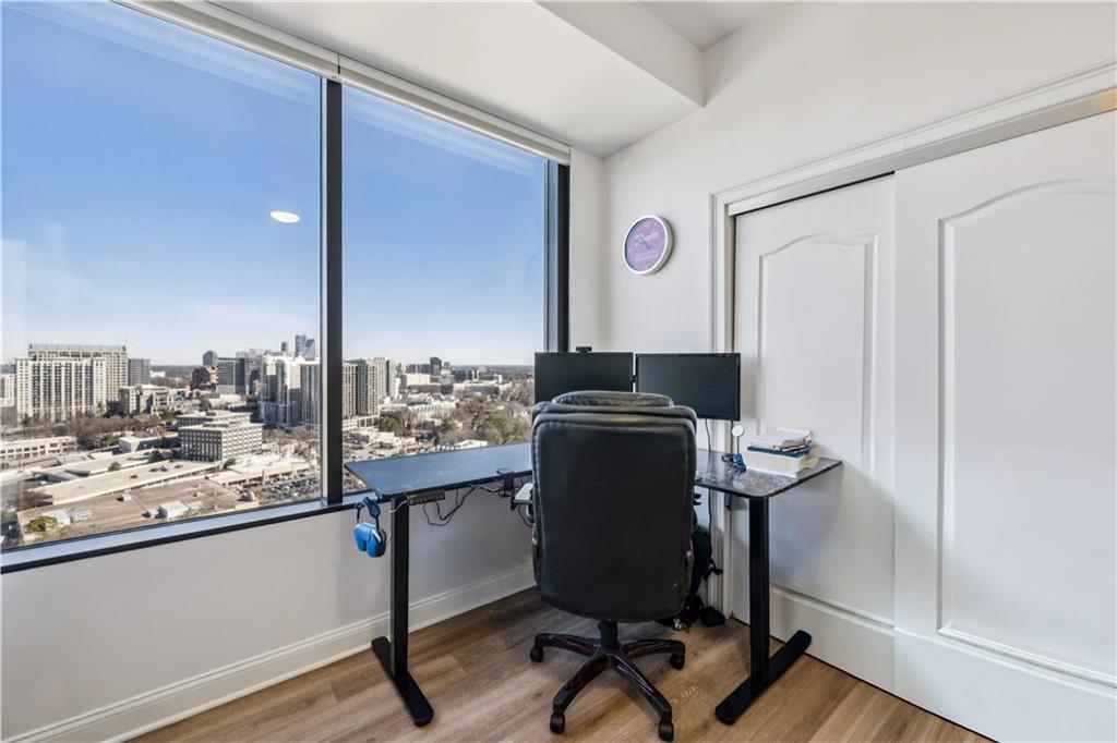 2828 Peachtree Road Northwest, Unit 2502 Atlanta, GA 30305 - Photo 8 of 38 a view of a workspace with furniture and a window