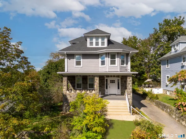 front view of a house with a yard