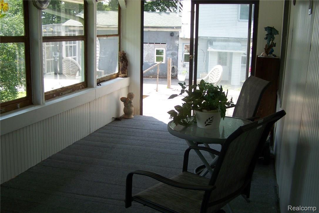 610 Young Road White Lake, MI 48383 - Photo 23 of 24 Screened in porch on lake side