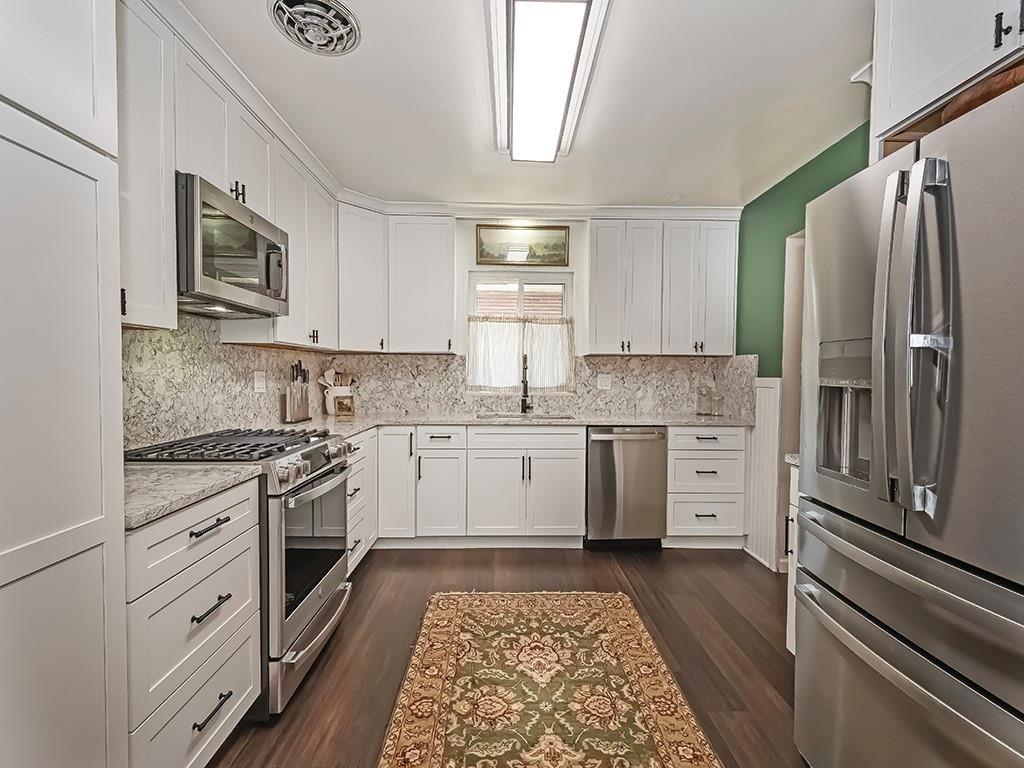 1024 Knollwood Road New Kensington, PA 15068 - Photo 5 of 23 a kitchen with stainless steel appliances white cabinets and a stove top oven