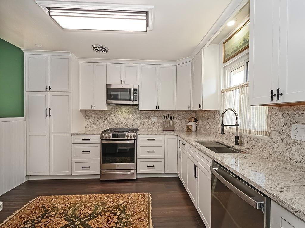 1024 Knollwood Road New Kensington, PA 15068 - Photo 6 of 23 a kitchen with granite countertop white cabinets and appliances