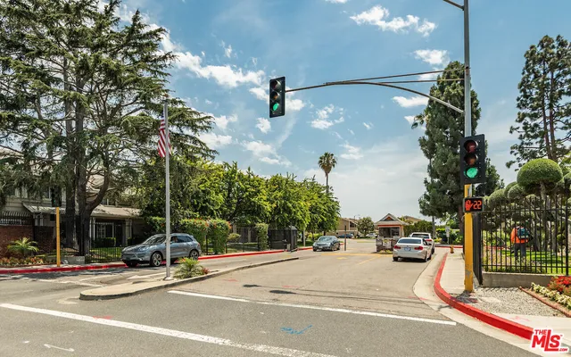a view of street with parked cars