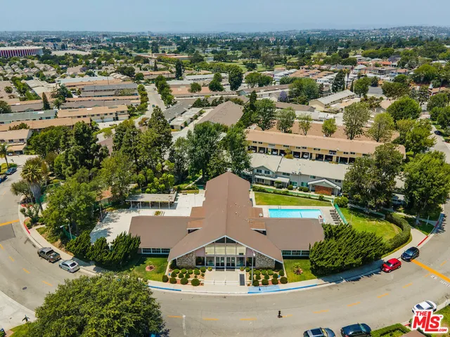 an aerial view of residential houses and outdoor space