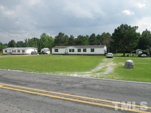 273 Massengill Pond Road Angier, NC 27501 - Photo 1 of 6 a view of a swimming pool and a yard