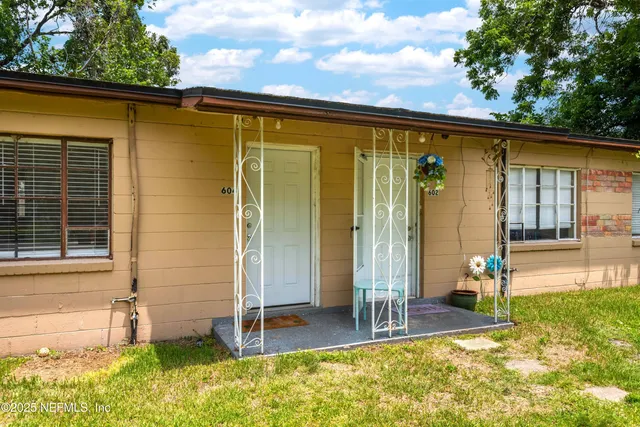 a backyard of a house with seating space