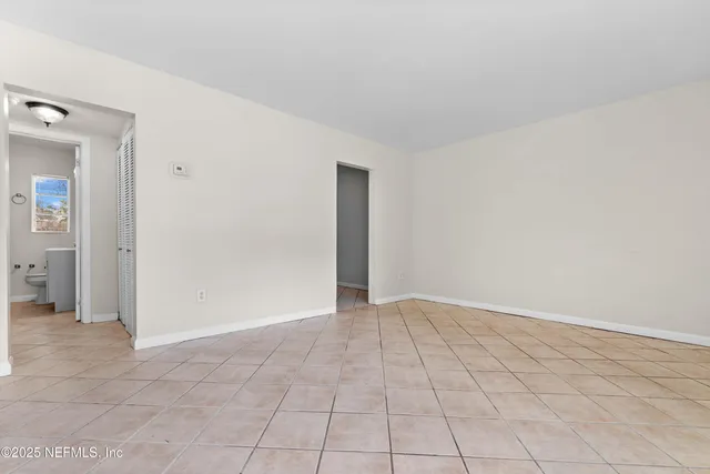 a view of an empty room and window