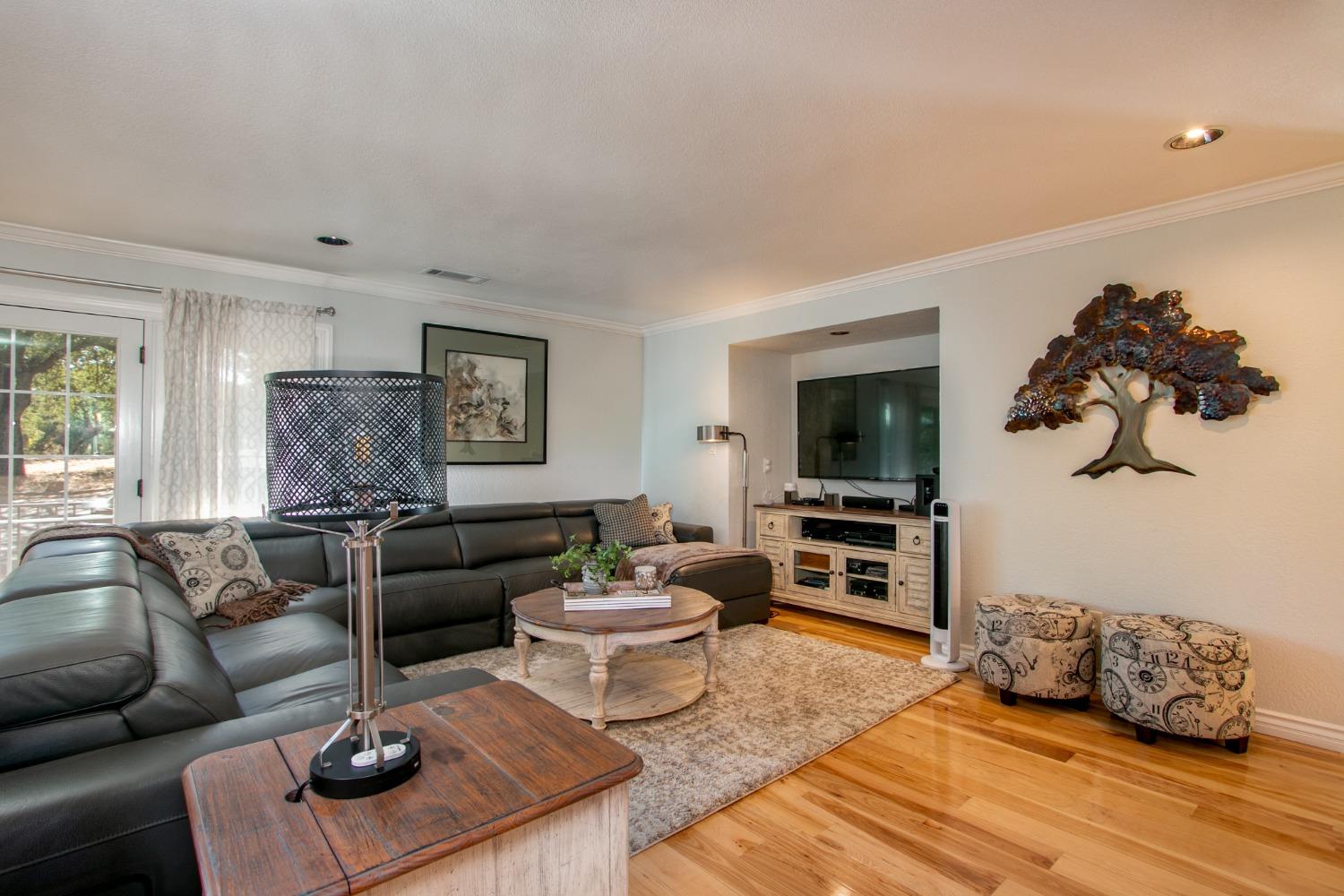 14975 Lago Drive Rancho Murieta, CA 95683 - Photo 11 of 41 a living room with furniture and a flat screen tv