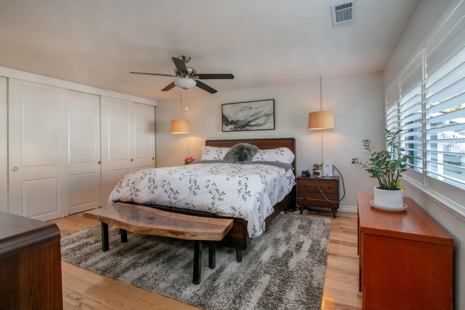 14975 Lago Drive Rancho Murieta, CA 95683 - Photo 13 of 41 a bedroom with a bed and a table in it