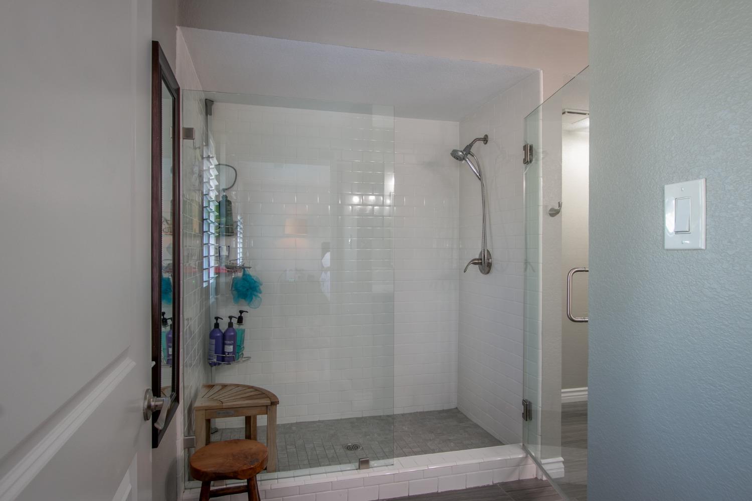 14975 Lago Drive Rancho Murieta, CA 95683 - Photo 15 of 41 a bathroom with a shower and a toilet