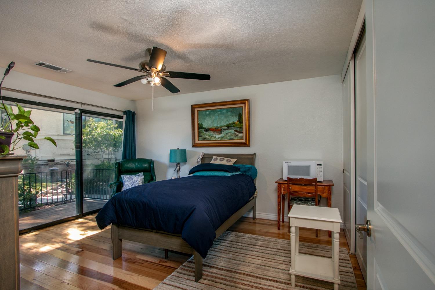 14975 Lago Drive Rancho Murieta, CA 95683 - Photo 17 of 41 a bedroom with a bed and a window