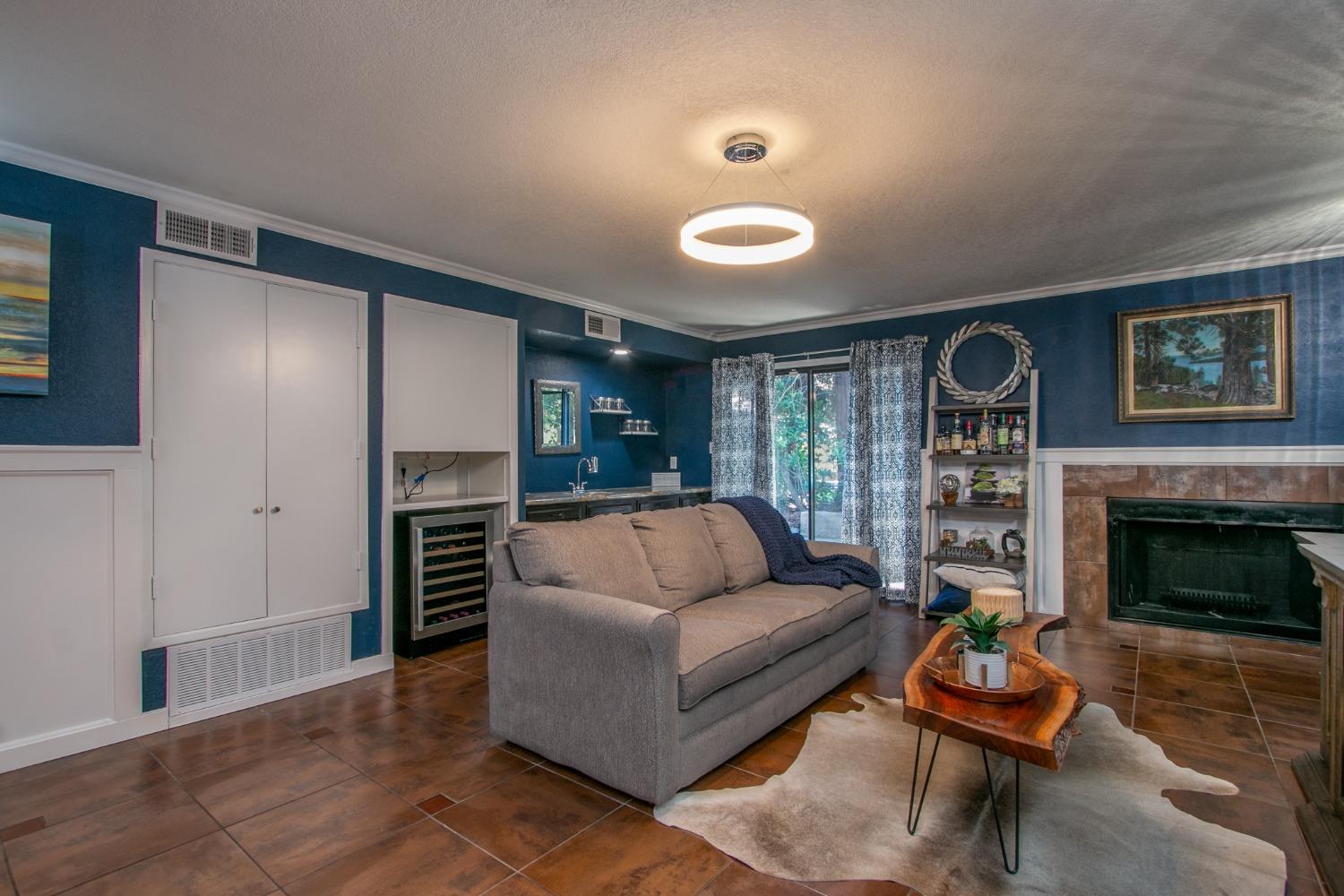 14975 Lago Drive Rancho Murieta, CA 95683 - Photo 21 of 41 a living room with furniture and a fireplace