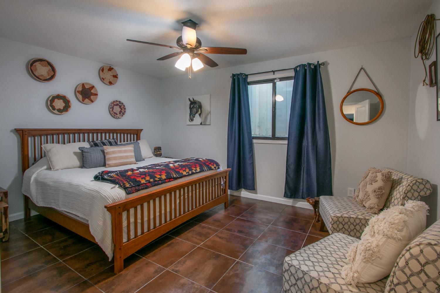 14975 Lago Drive Rancho Murieta, CA 95683 - Photo 23 of 41 a bedroom with a bed and window