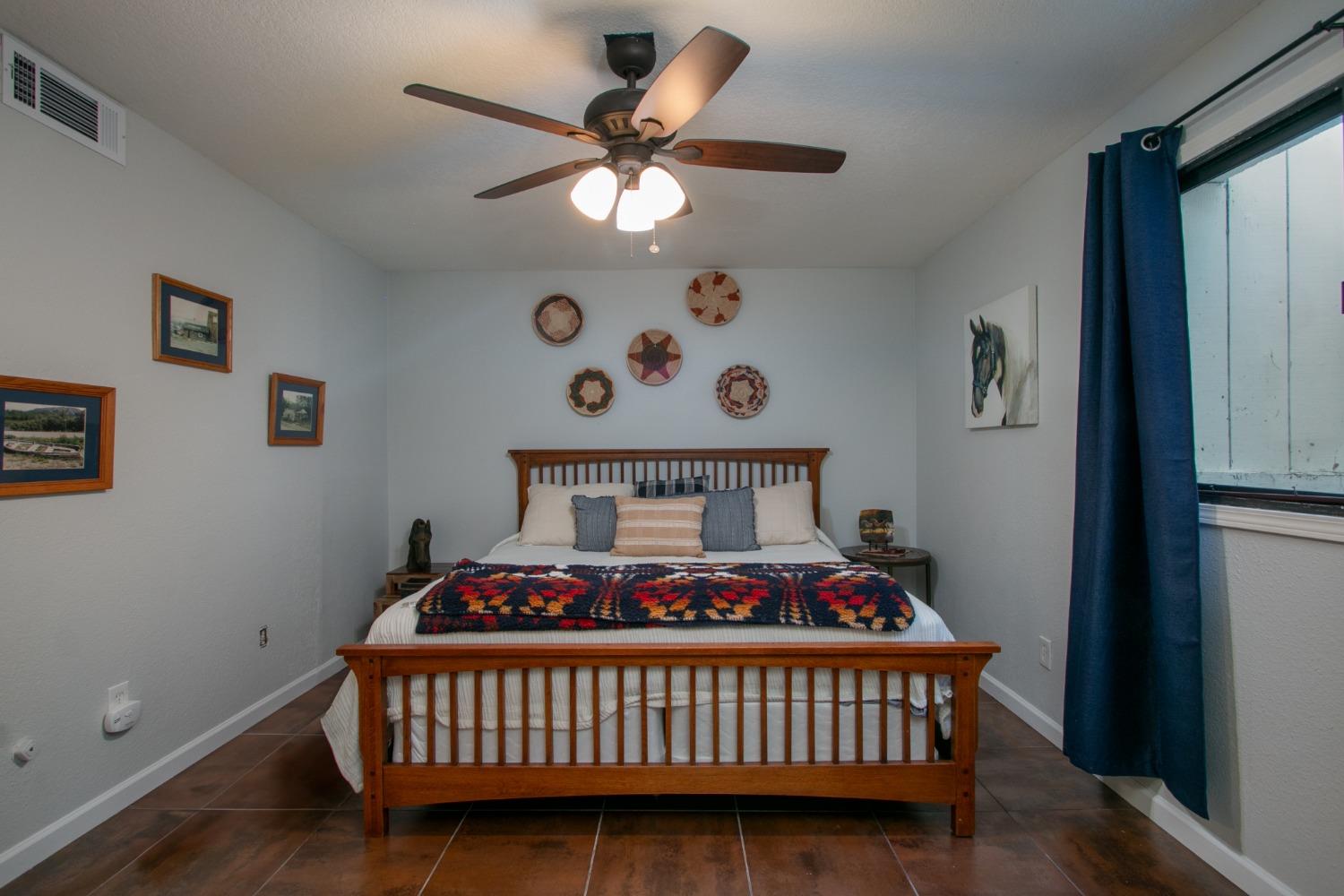 14975 Lago Drive Rancho Murieta, CA 95683 - Photo 24 of 41 a bedroom with a bed and a dresser in it