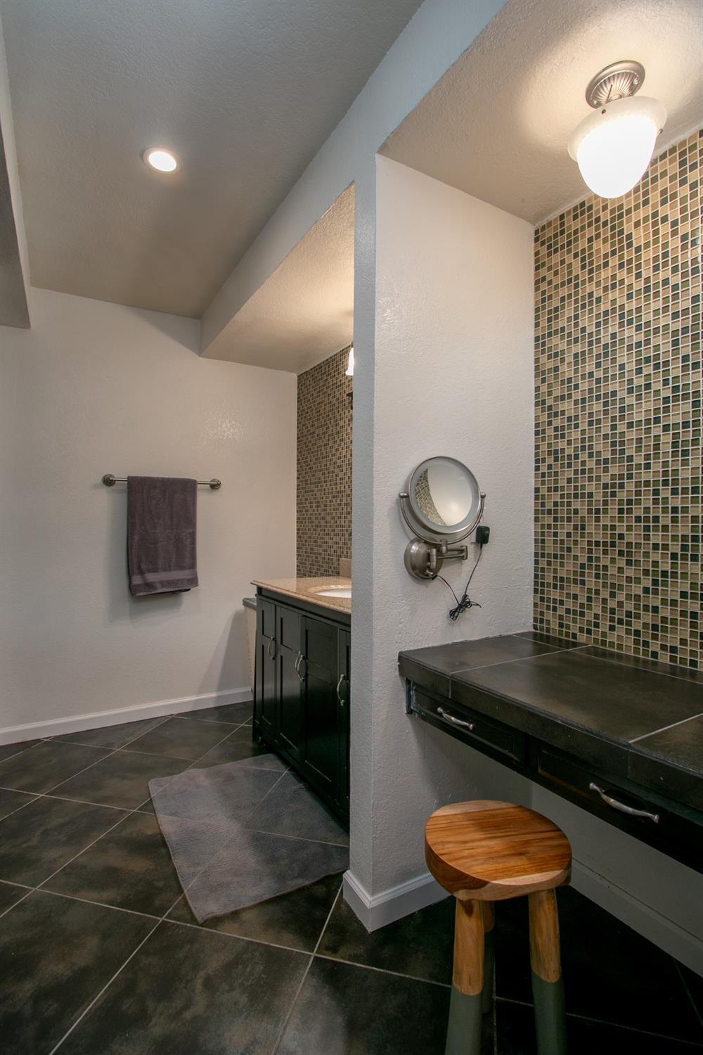 14975 Lago Drive Rancho Murieta, CA 95683 - Photo 25 of 41 a bathroom with a sink and a mirror