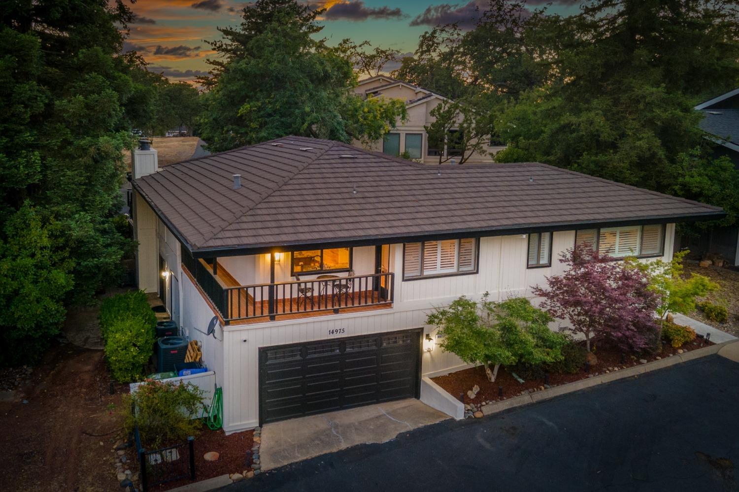 14975 Lago Drive Rancho Murieta, CA 95683 - Photo 30 of 41 a front view of a house with a garden
