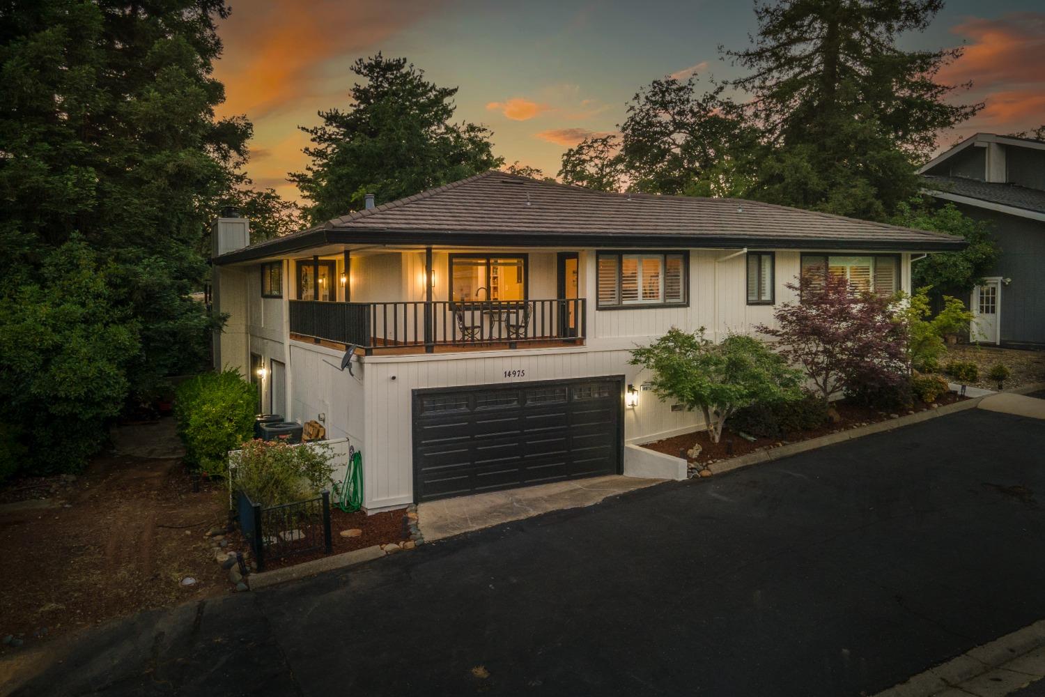 14975 Lago Drive Rancho Murieta, CA 95683 - Photo 31 of 41 a front view of a house with a garden