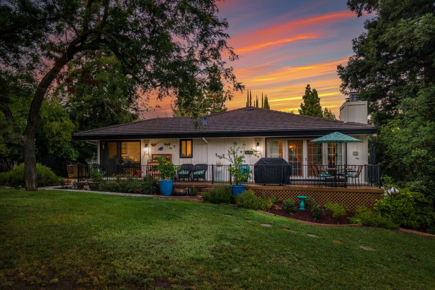14975 Lago Drive Rancho Murieta, CA 95683 - Photo 35 of 41 a front view of a house with a yard and porch