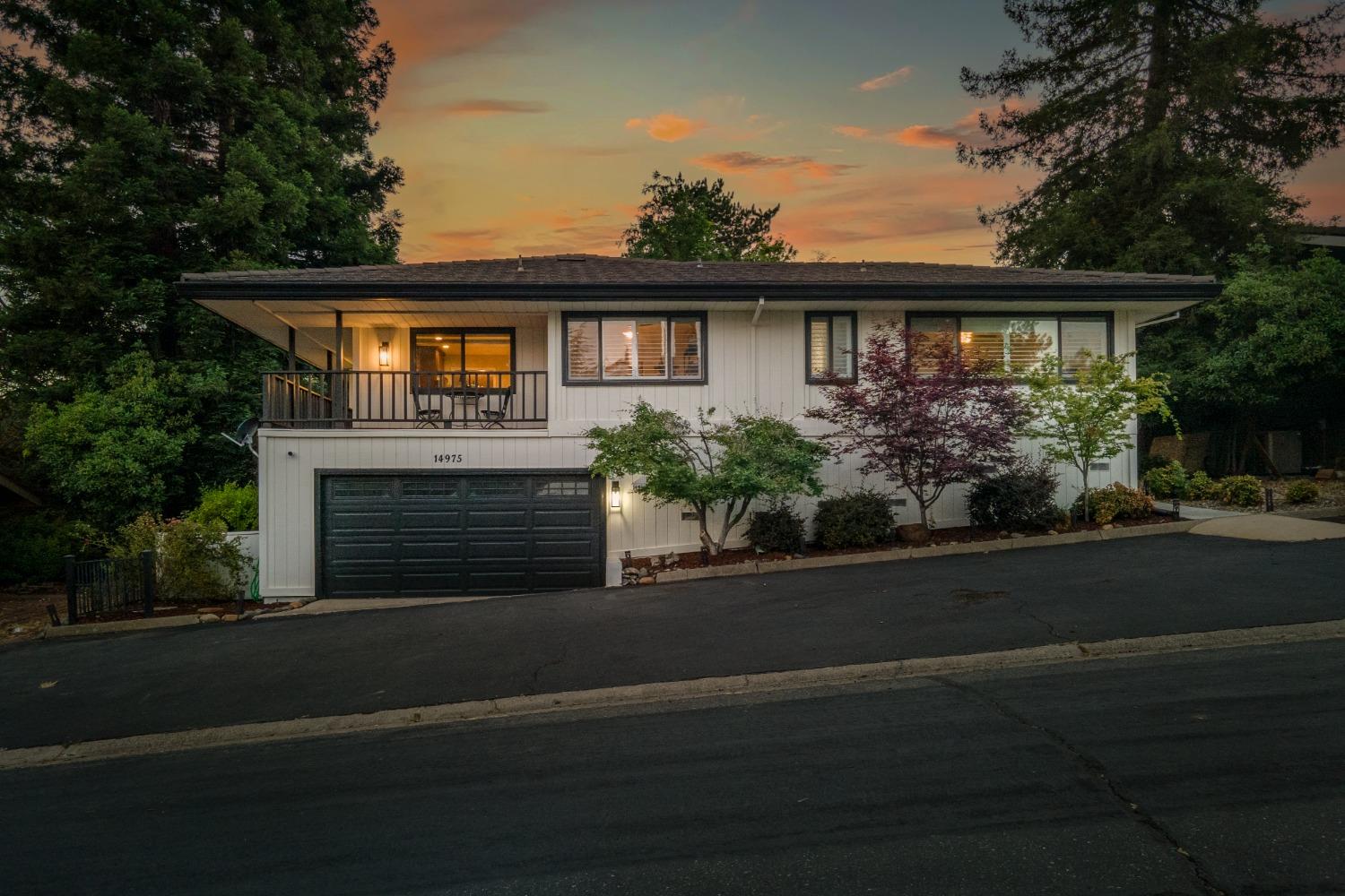 14975 Lago Drive Rancho Murieta, CA 95683 - Photo 40 of 41 a front view of a house with a garden