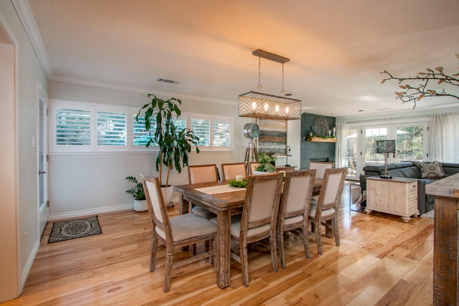 14975 Lago Drive Rancho Murieta, CA 95683 - Photo 7 of 41 a view of a dining room with furniture window and wooden floor
