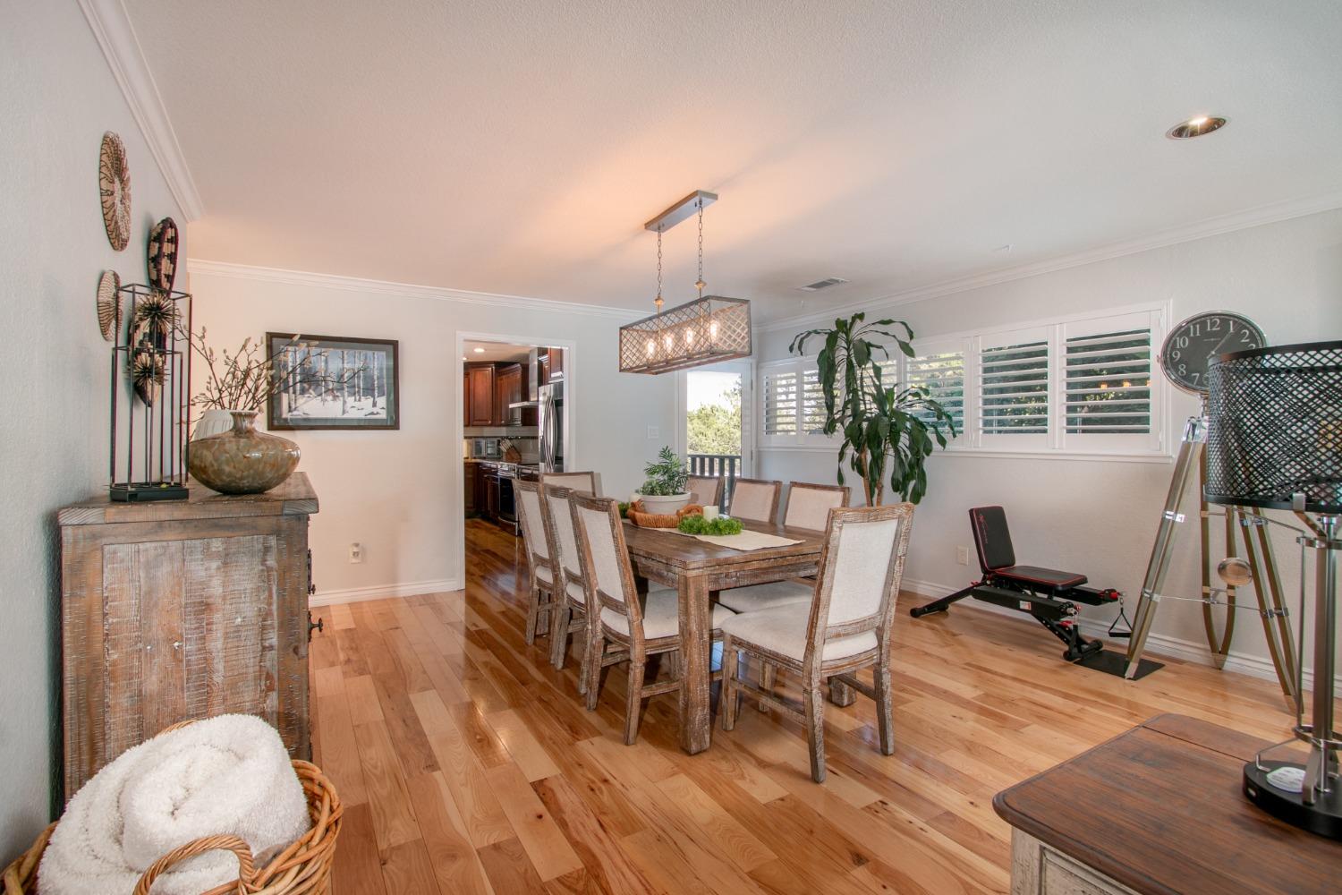 14975 Lago Drive Rancho Murieta, CA 95683 - Photo 9 of 41 a view of a dining room with furniture window and wooden floor