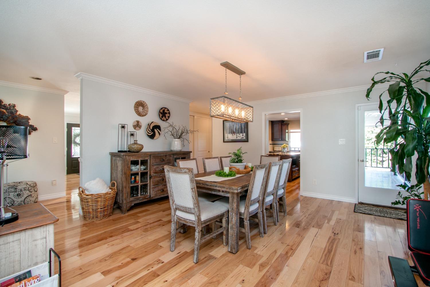 14975 Lago Drive Rancho Murieta, CA 95683 - Photo 10 of 41 a view of a dining room with furniture and wooden floor