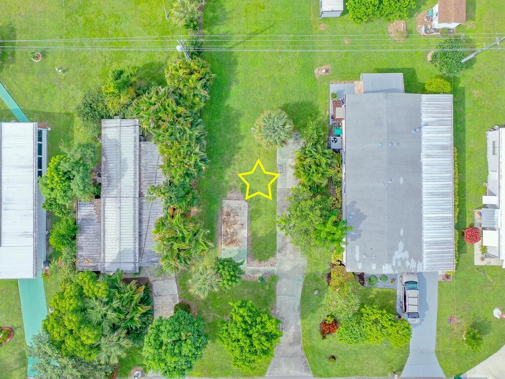 9 St Tropez Drive Naples, FL 34112 - Photo 6 of 10 an aerial view of a house with a yard