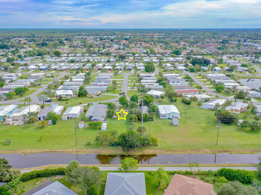 9 St Tropez Drive Naples, FL 34112 - Photo 7 of 10 an aerial view of residential houses with outdoor space and trees