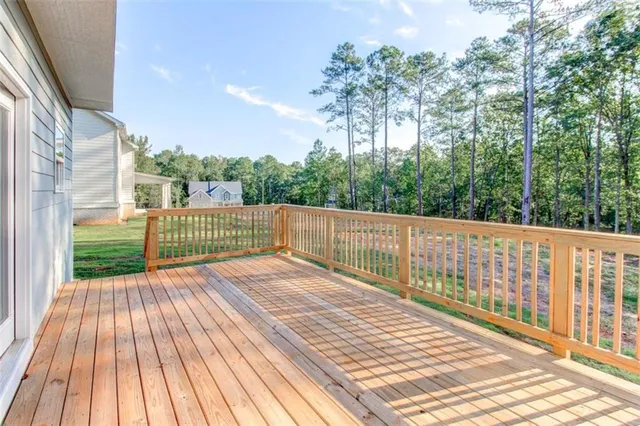 a view of wooden deck and a garden